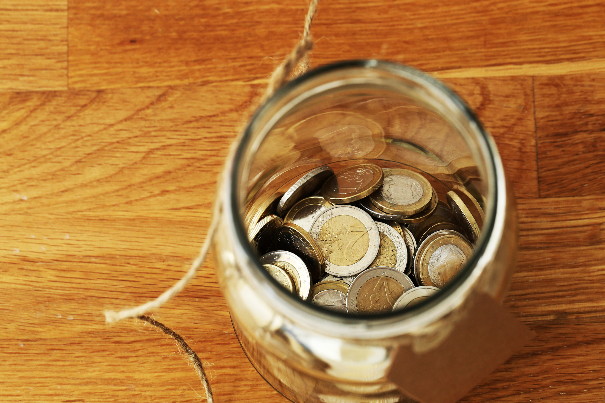 Finances. Euro coins in a jar