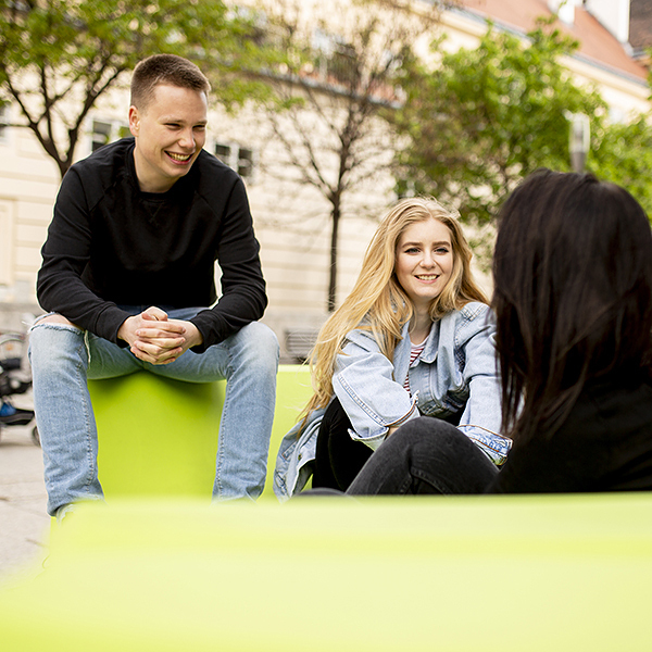 Group of young people sitting on the lounge seats in Vienna, Austria
