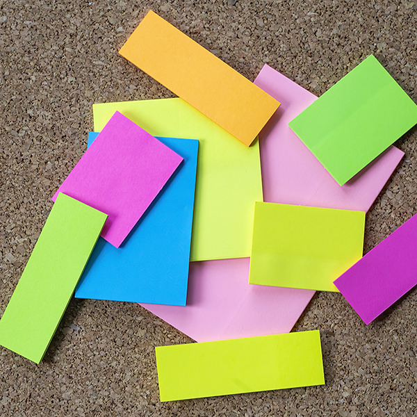 Collection of various note papers on corkboard